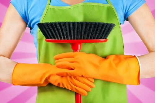 Staff following carpet cleaning safety procedures responsibly