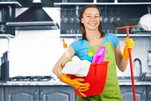 Deep cleaning team working in a SW18 home kitchen and bathroom