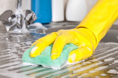 End of tenancy cleaning team working in a SW18 flat with access challenges